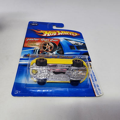 Aston Martin V8 Vantage #11 * Yellow w/ FTE Faster Than Ever * Hot Wheels 2005
